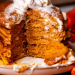 Stack of pumpkin pancakes on a plate.