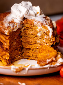 Stack of pumpkin pancakes on a plate.