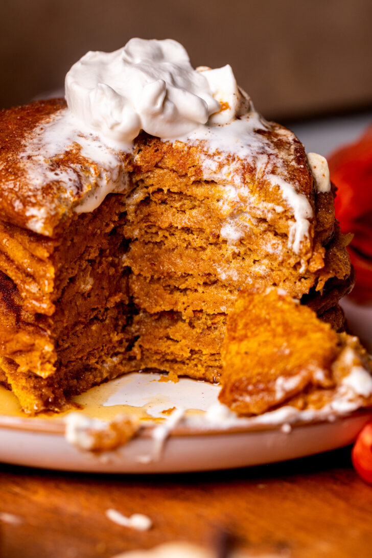 Stack of pumpkin pancakes on a plate.