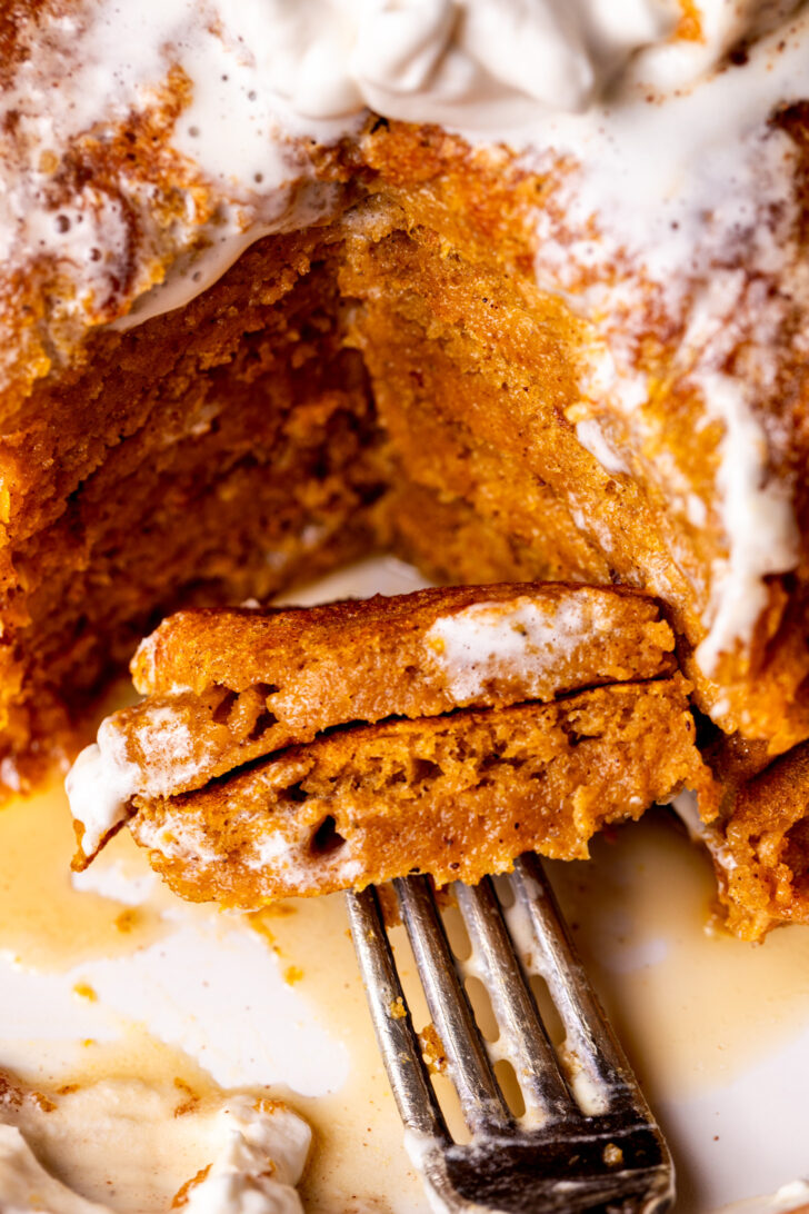 Close up of a bite of pumpkin pancakes.