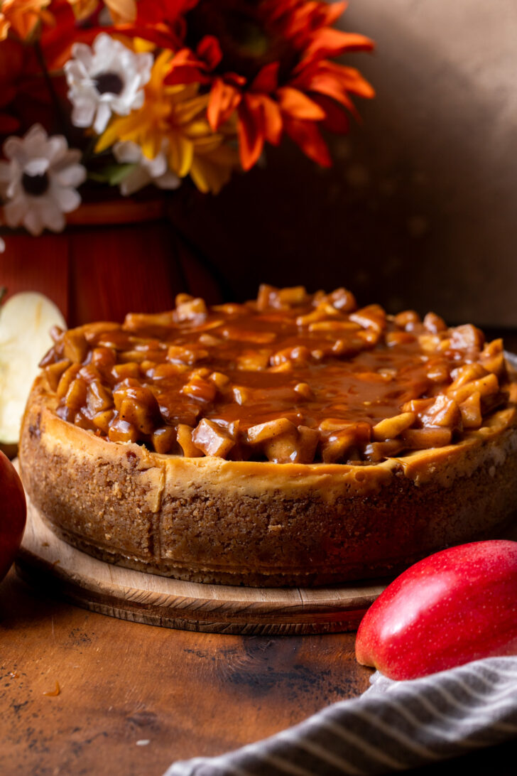 Decorated cheesecake on a board.