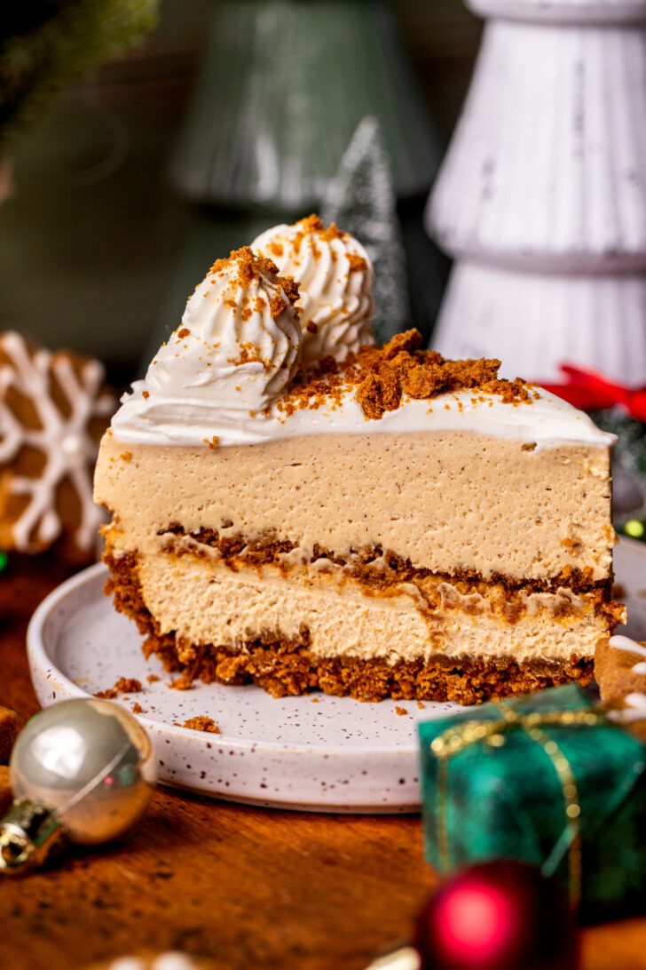 One slice of no bake gingerbread cheesecake on a plate.