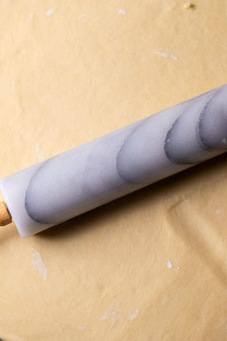 Rolling out the dough.