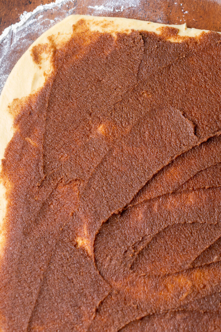 Cinnamon filling on top of dough.