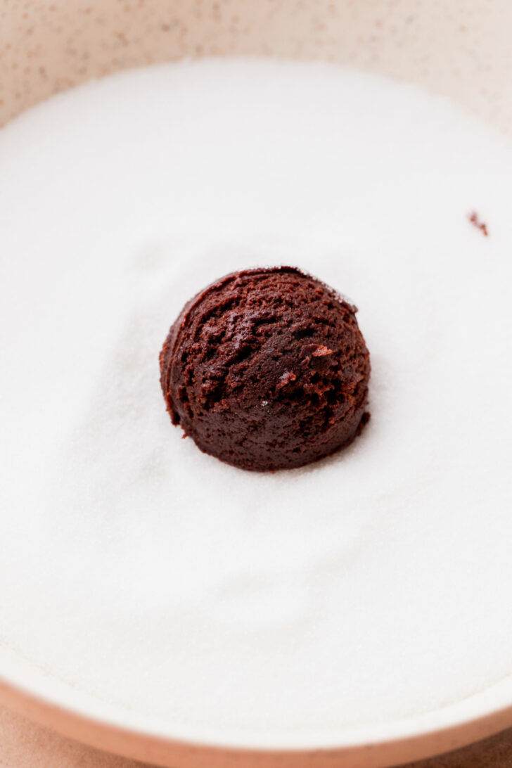 Cookie dough ball in sugar.