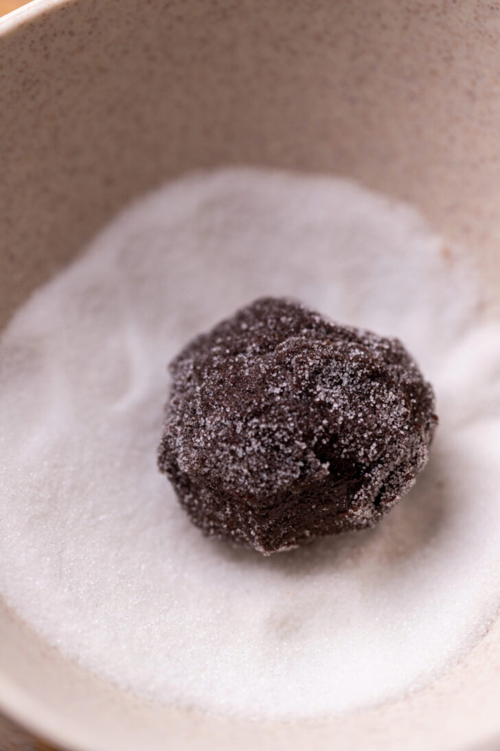 Cookie dough ball in the sugar.
