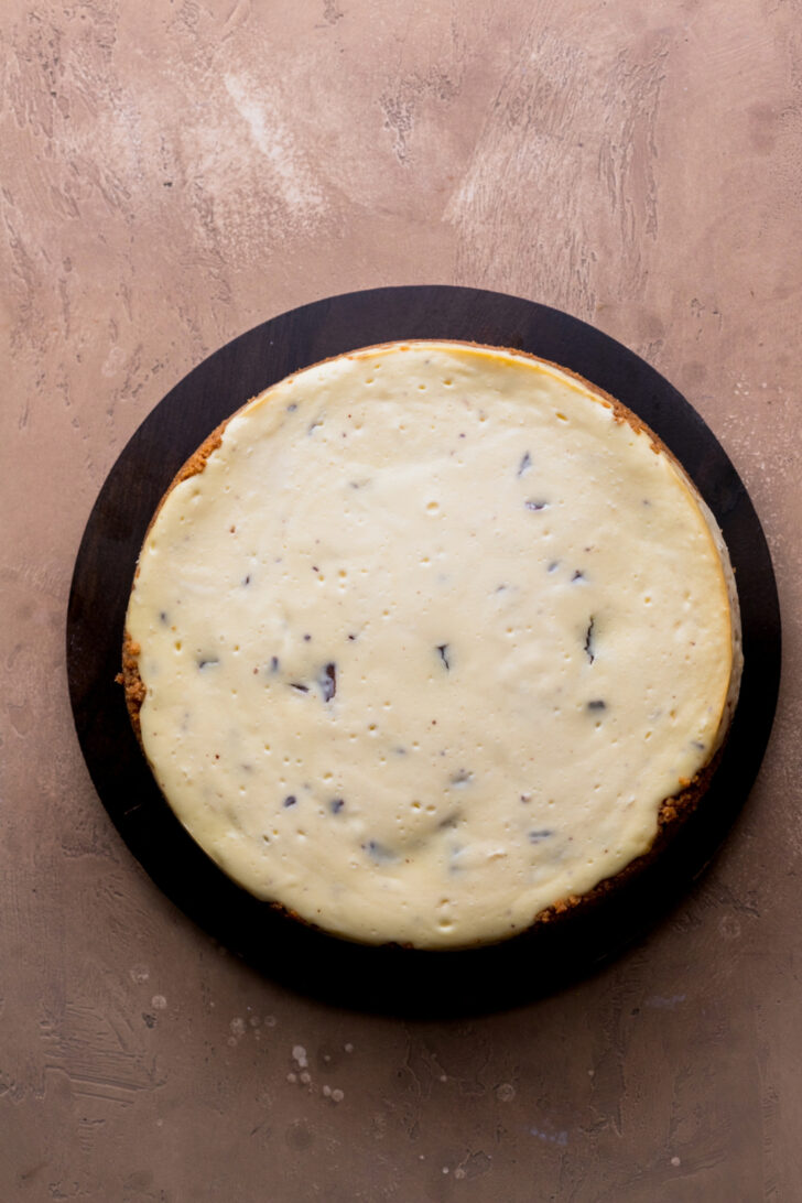 Baked cheesecake on a platter.