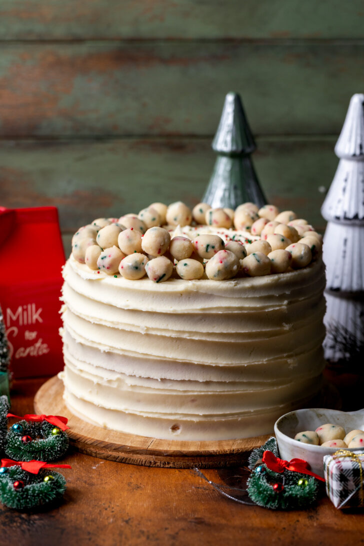 Decorated cake on a wood board.