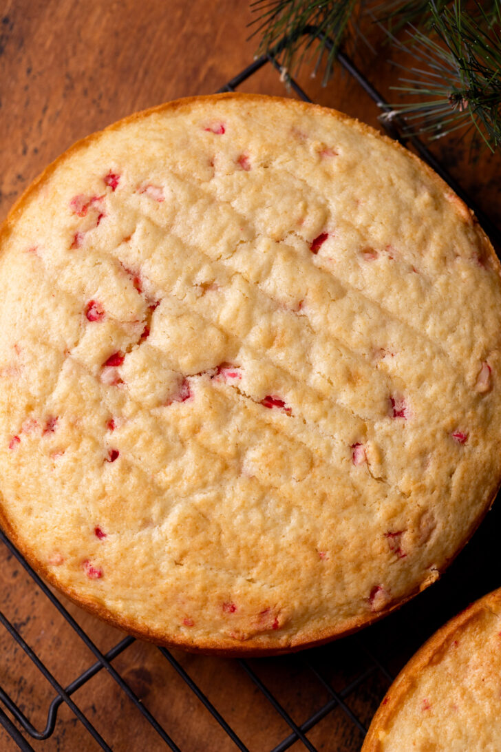 Baked cake layer on a wire rack.