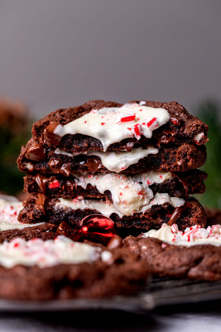 Stack of two peppermint bark cookies split in half.