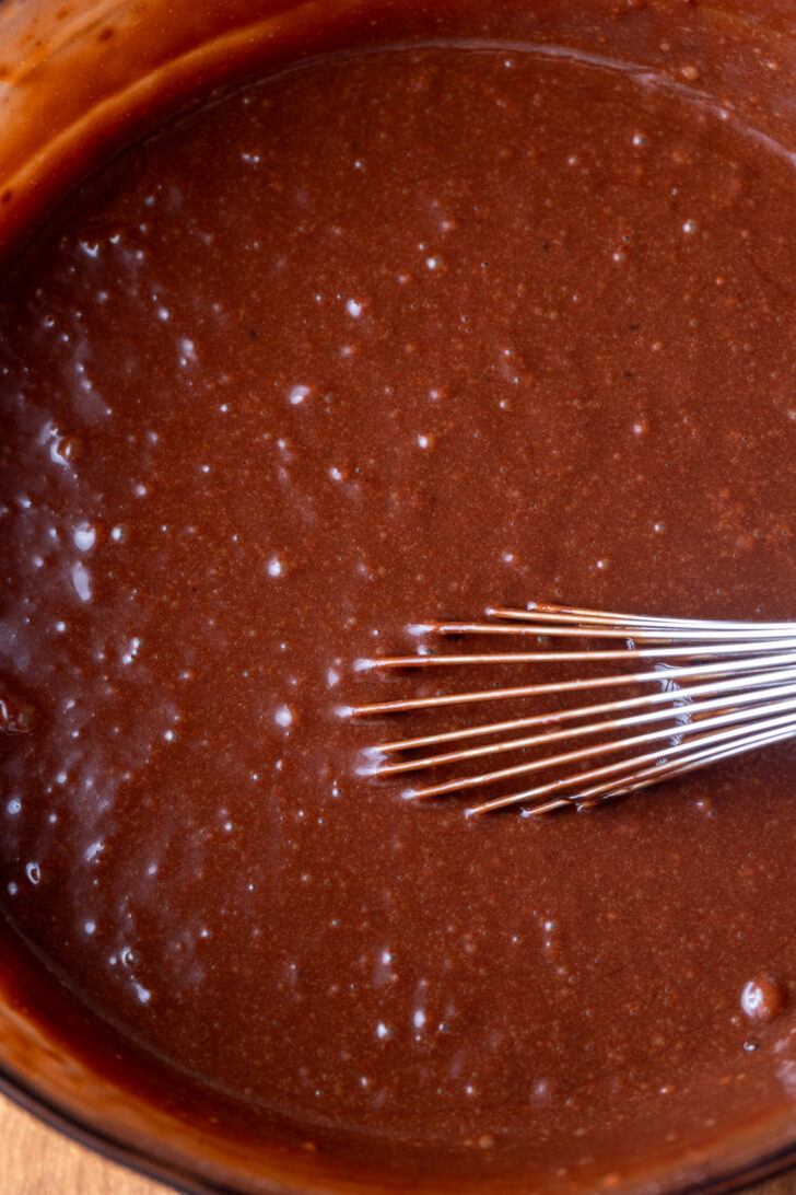 Chocolate cake batter in a bowl.