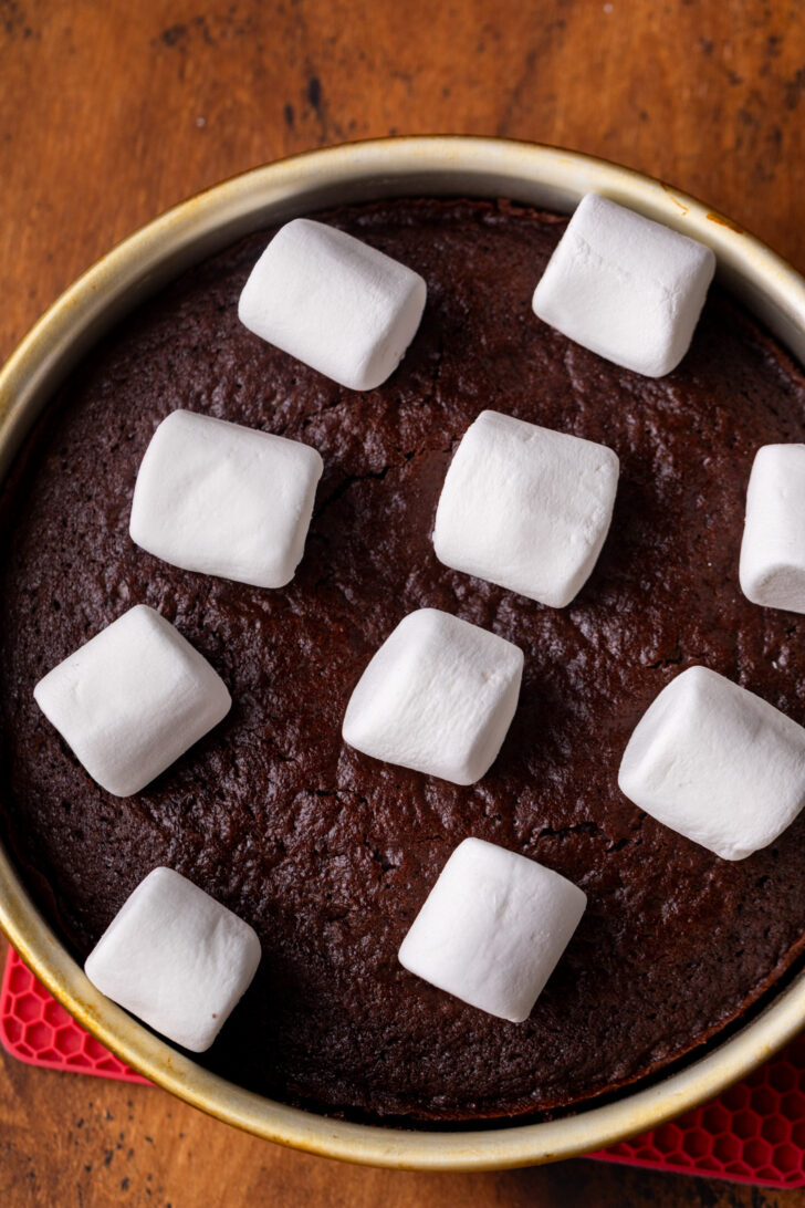 Marshmallows on top of cake layer.