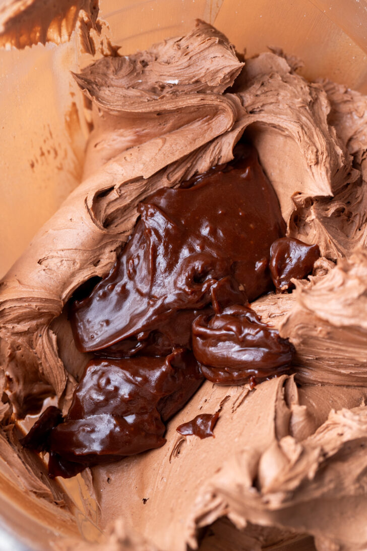 Hot chocolate fudge on top of the frosting.