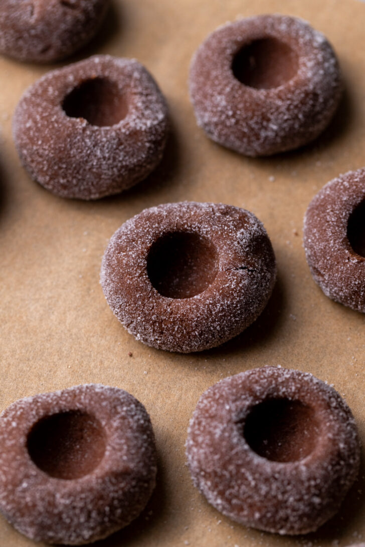Cookie dough balls with a hole in the middle.