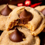 Bite missing from peanut butter cookie blossoms.