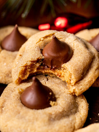 Bite missing from peanut butter cookie blossoms.