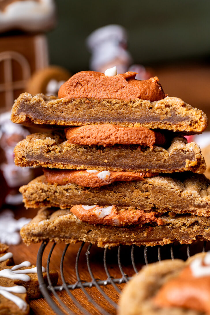 Stack of two molasses cookies split in half.