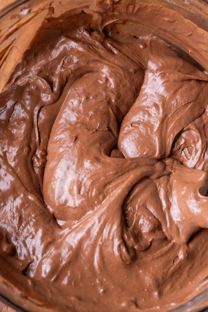 Chocolate cheesecake batter in a bowl.