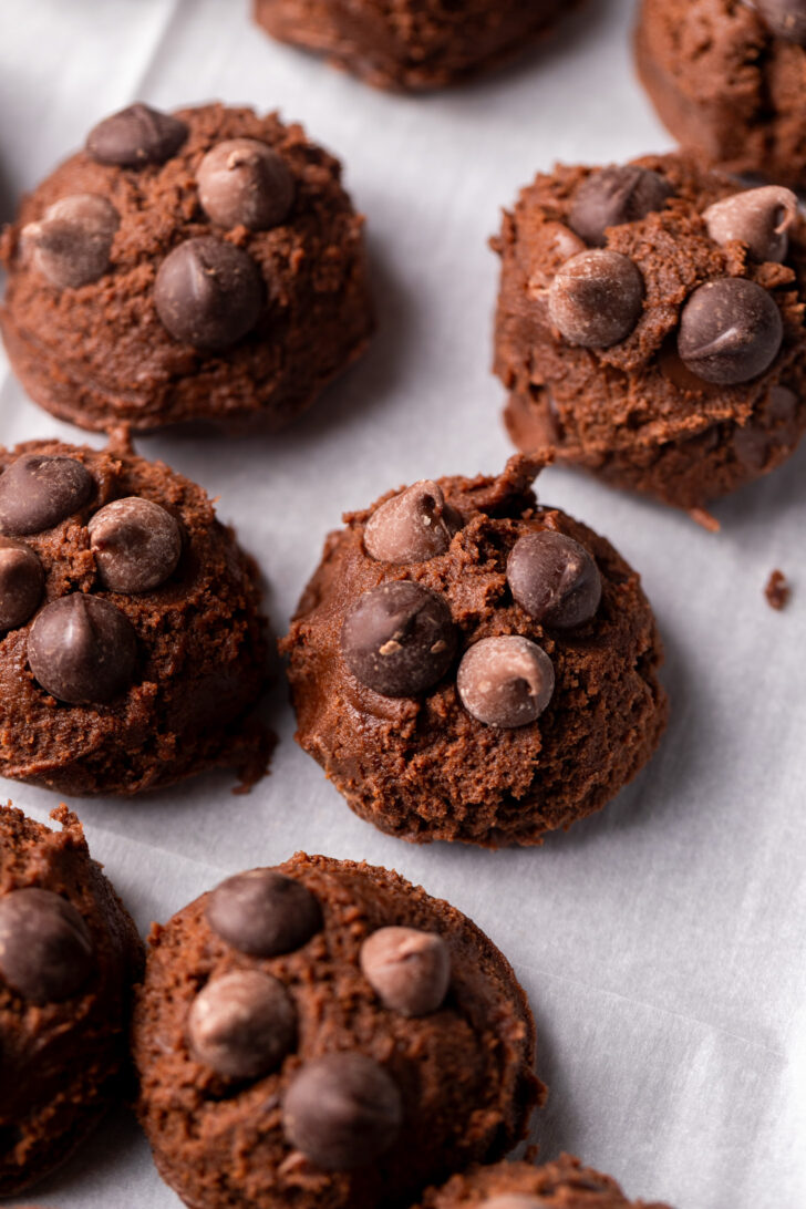 Cookie dough balls on a cookie sheet.