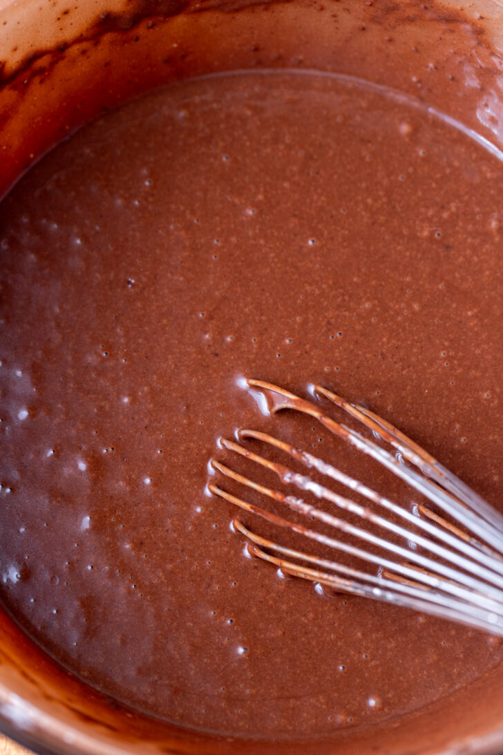 Chocolate cake batter in a bowl.