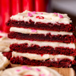 Stack of two red velvet cupcake cookies split in half.