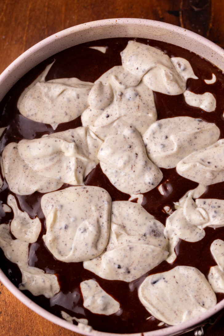 Oreo batter and chocolate batter layered with each other.