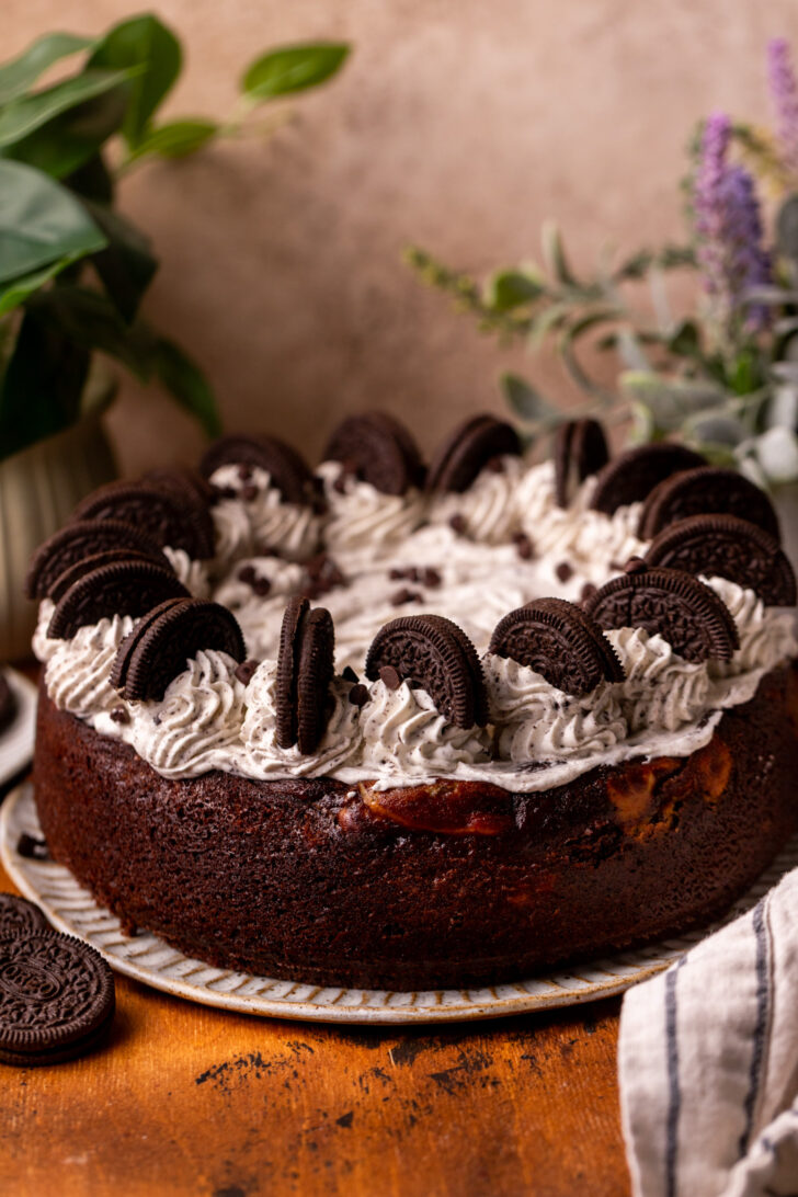 Decorated cheesecake on a platter.