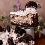Taking a slice out of the Oreo cake cheesecake.