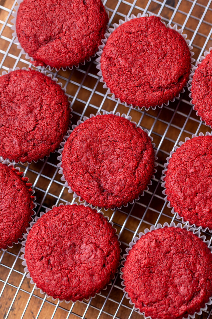 Cupcakes on a wire rack.