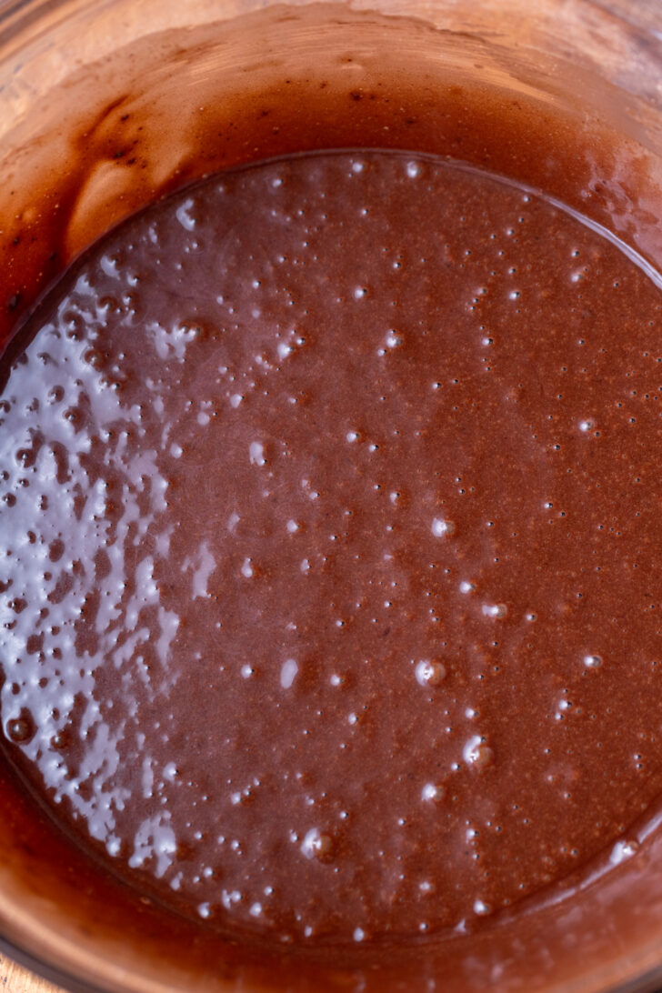 Chocolate cake batter in a bowl.