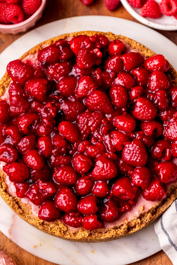 Decorated cheesecake top view on a platter.