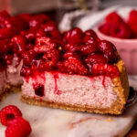 Taking a slice out of the raspberry cheesecake.
