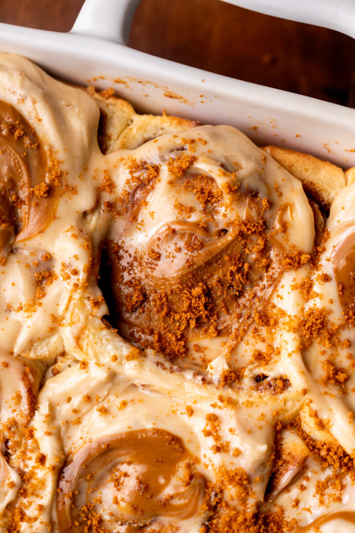 Close up of Biscoff cinnamon rolls in pan.