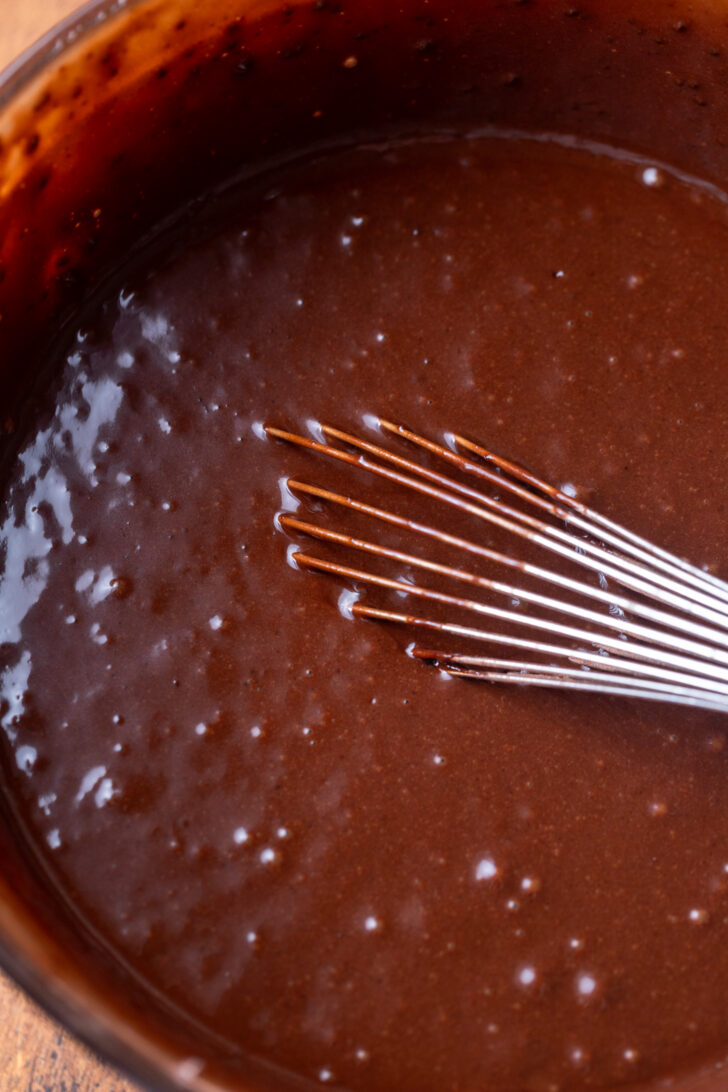 Chocolate cake batter in a bowl.