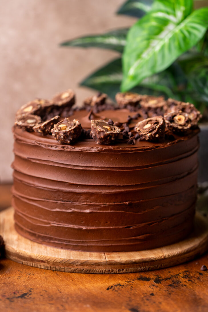 Decorated cake on a wood board.