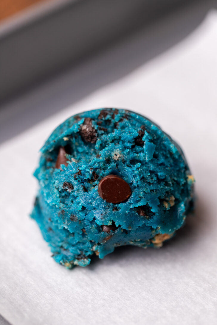 Cookie dough ball on a cookie sheet.