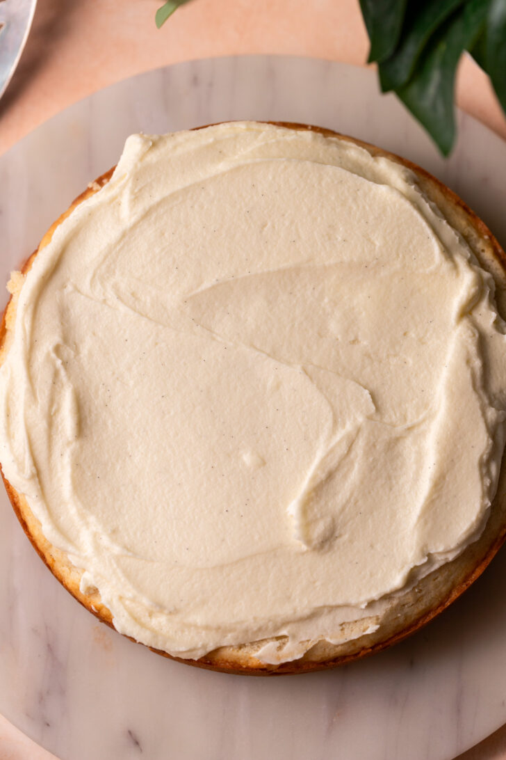 Frosting on top of cake layer.