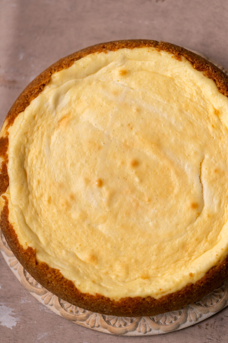 Baked cheesecake on a platter.