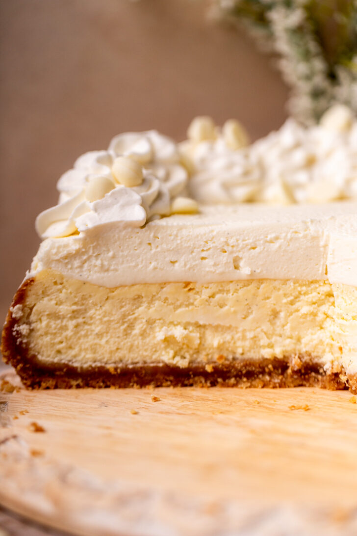Side view of opened vanilla bean cheesecake.