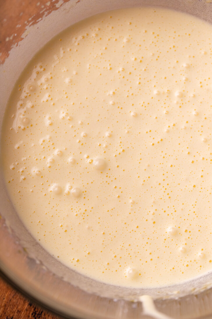 Whipped sugar and eggs in a bowl.