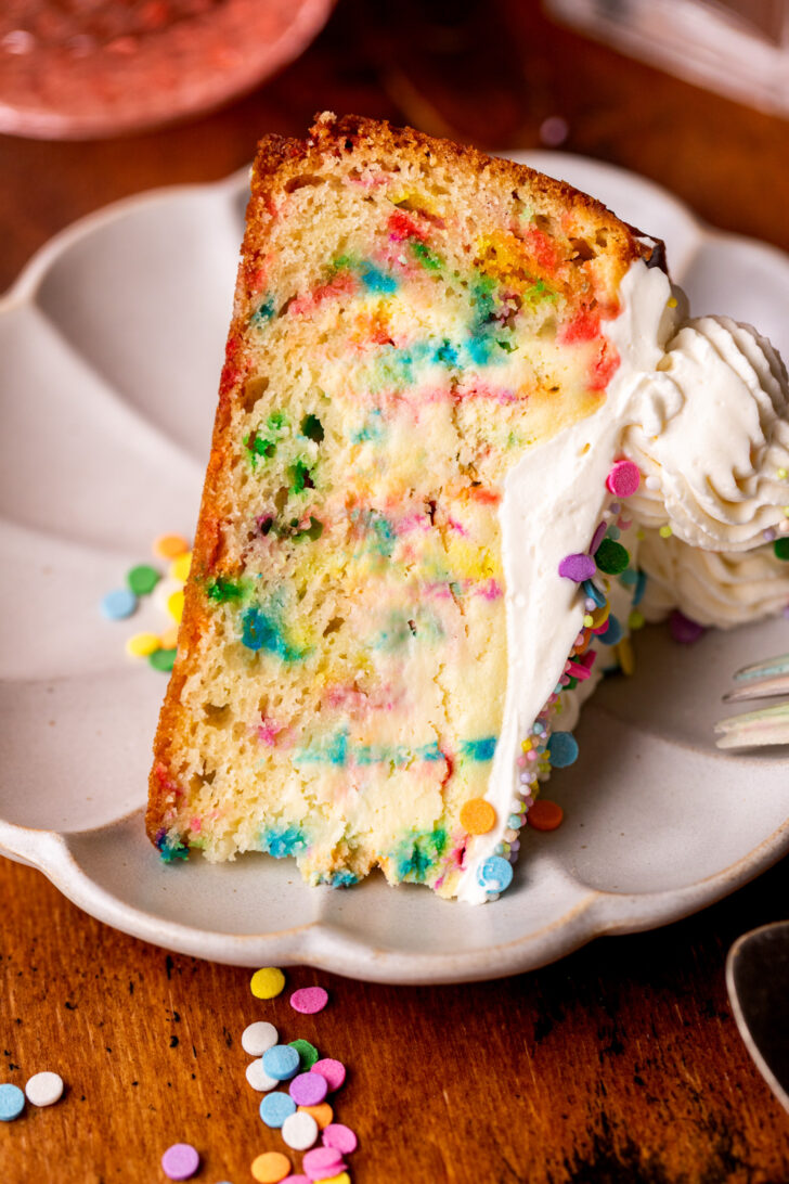 Slice of cheesecake on a plate on it's side.