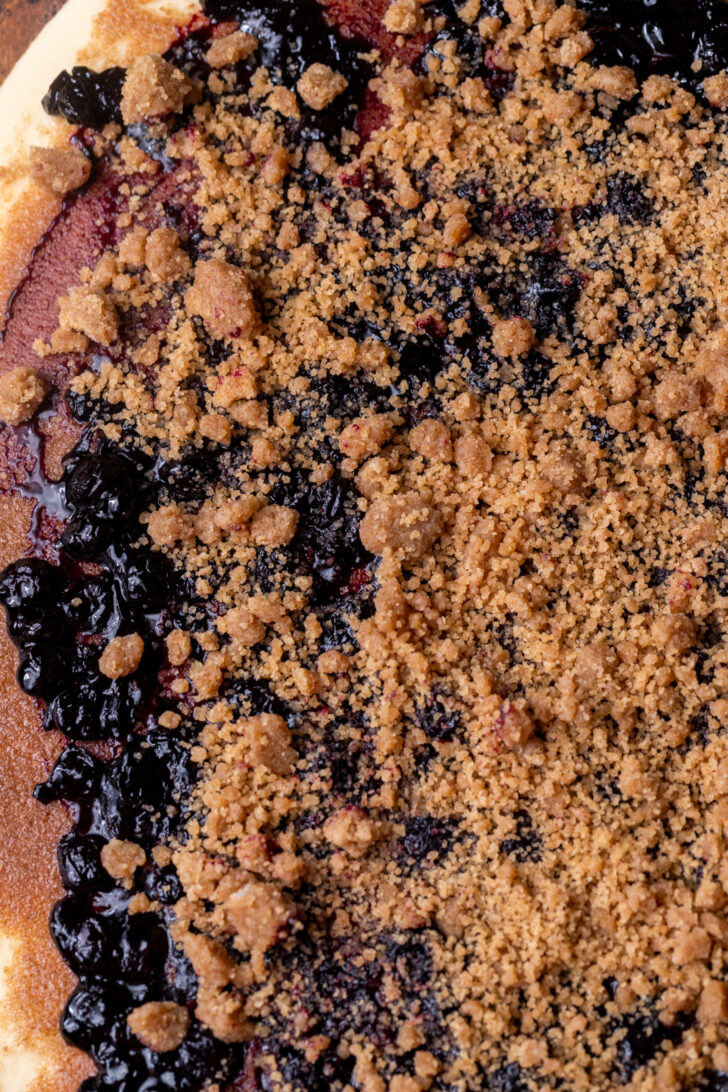 Blueberry jam and cinnamon crumble on top of dough.