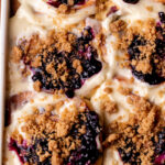Top view of baked blueberry muffin cinnamon rolls.