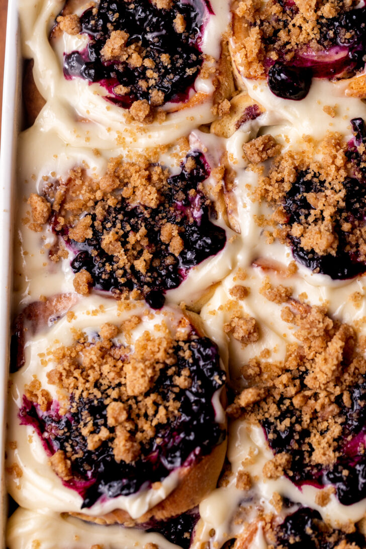 Top view of baked blueberry muffin cinnamon rolls.
