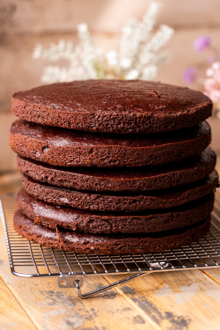 Baked cake layers stacked on top of each other.
