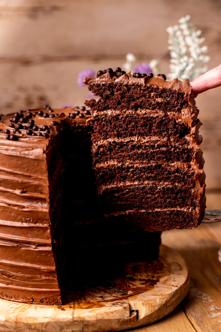 Taking a slice out of the chocolate fudge cake.