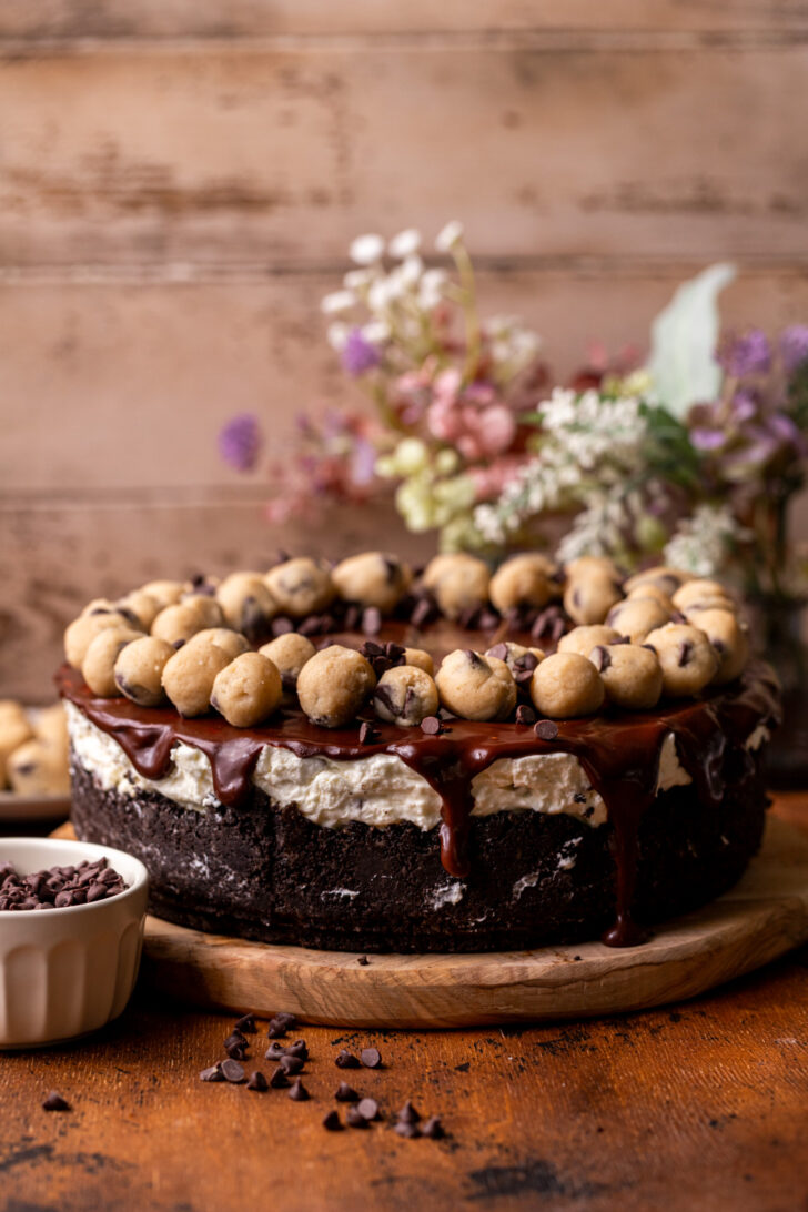 Decorated pie on top of a wood platter.
