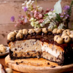 Opened up cookie dough pie on a wood platter.