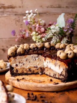 Opened up cookie dough pie on a wood platter.