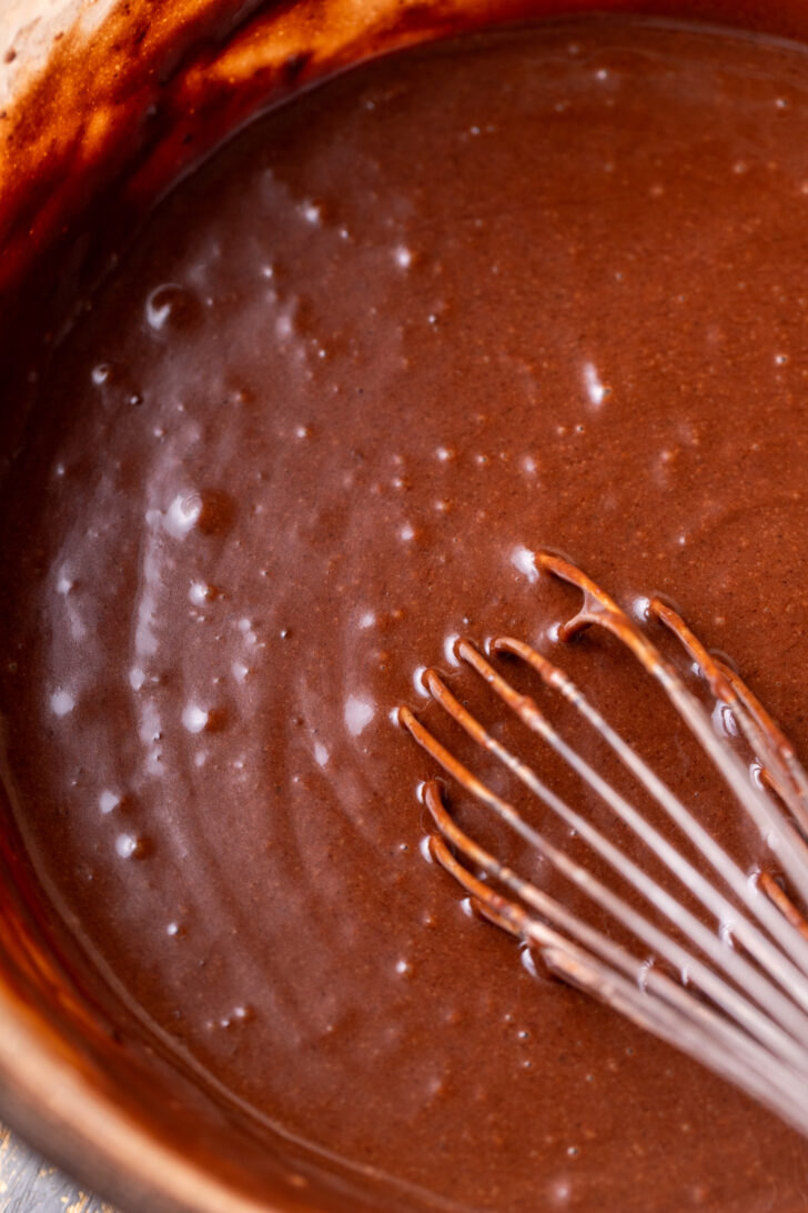 Chocolate cake batter in a bowl.